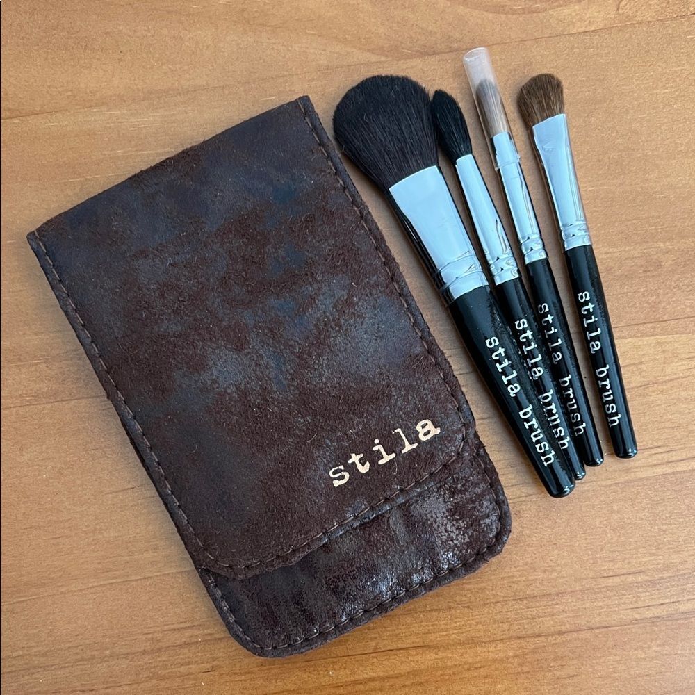 Stila  Beauty Essential Brush Travel Collection set with a brown foldable pouch